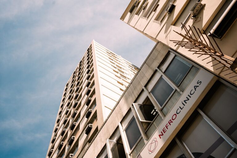 Low angle view of a modern office building in Rio de Janeiro under a blue sky.