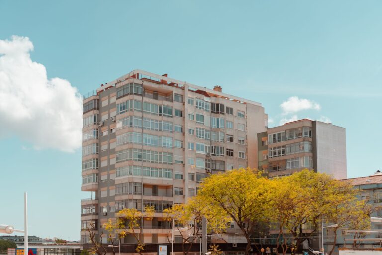 A contemporary high-rise building in Lisbon, Portugal, on a sunny day with clear skies.